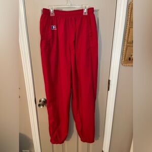 Russell women’s vintage red lined nylon track pants w/pocket zip ankles. Size L